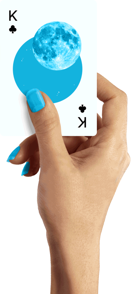 A woman's hand holding a card with a fish floating in the center
