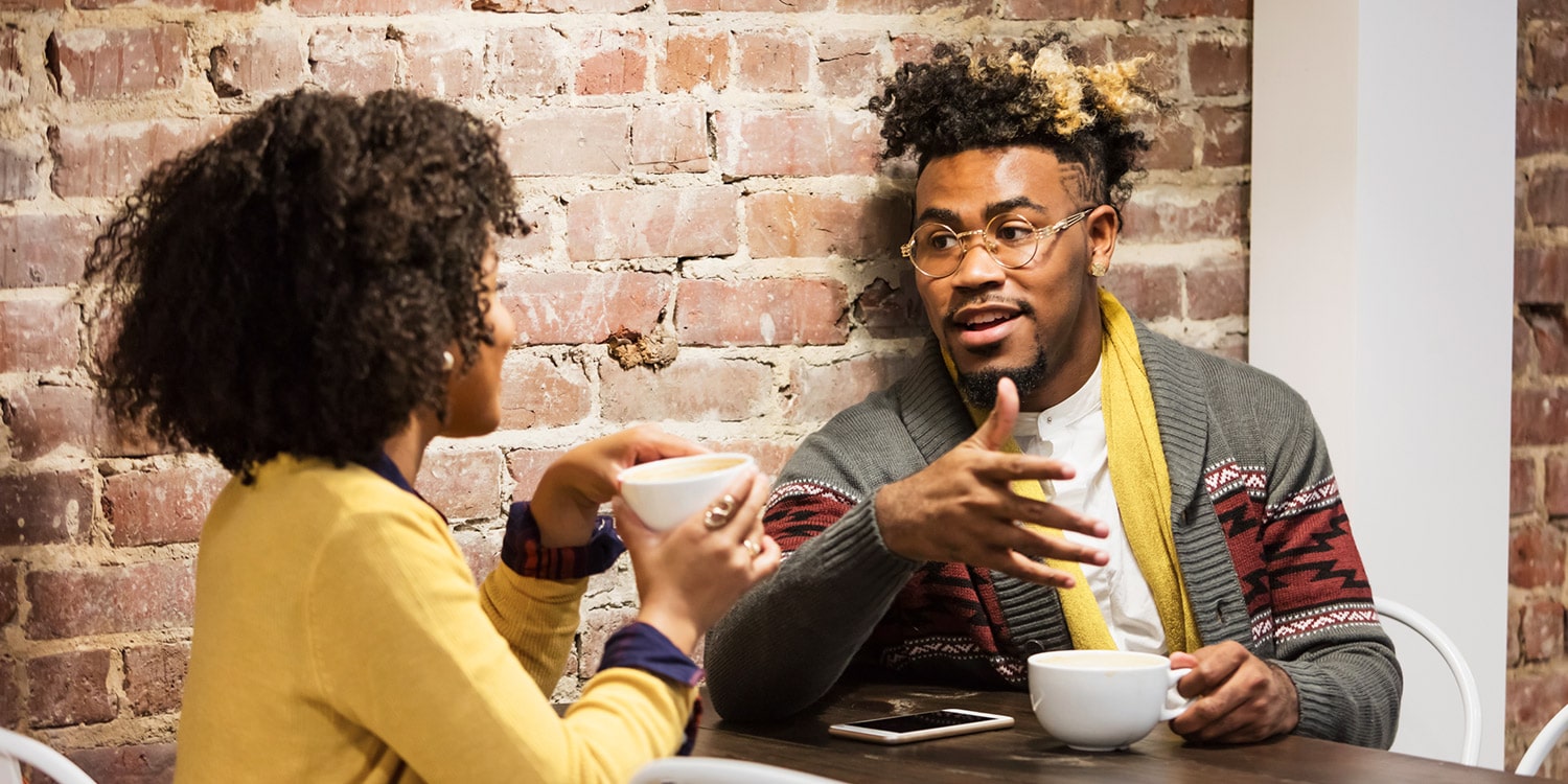 couple discussing finances over coffee