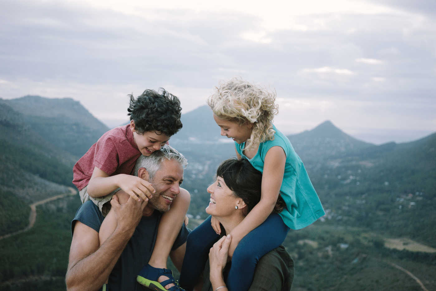A family has some fun while on a hike in the mountains