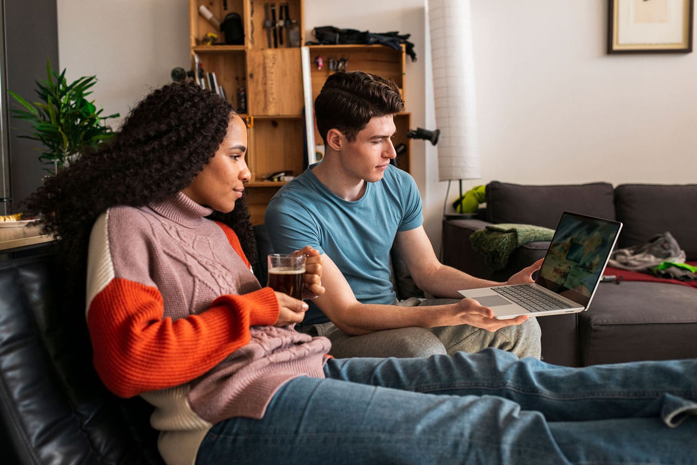 Mixed Race Friends Relaxing in Kitchen Bonding Together Drinking